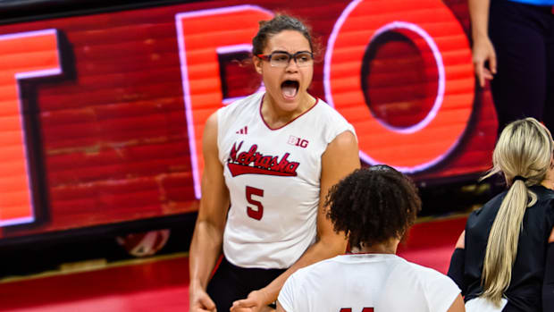 Rebekah Allick (5) celebrates winning set point in the first. 