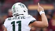 Nov 1, 2025; Minneapolis, Minnesota, USA; Michigan State Spartans quarterback Alessio Milivojevic (11) celebrates a touchdown against the Minnesota Golden Gophers during the second half at Huntington Bank Stadium. Mandatory Credit: Matt Krohn-Imagn Images