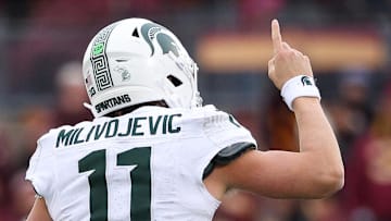 Nov 1, 2025; Minneapolis, Minnesota, USA; Michigan State Spartans quarterback Alessio Milivojevic (11) celebrates a touchdown against the Minnesota Golden Gophers during the second half at Huntington Bank Stadium. Mandatory Credit: Matt Krohn-Imagn Images