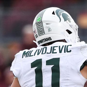 Nov 1, 2025; Minneapolis, Minnesota, USA; Michigan State Spartans quarterback Alessio Milivojevic (11) celebrates a touchdown against the Minnesota Golden Gophers during the second half at Huntington Bank Stadium. Mandatory Credit: Matt Krohn-Imagn Images