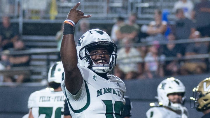 Hawaii Warriors quarterback Dalen Morris (19) celebrates his touchdown against Vanderbilt at FirstBank Stadium in Nashville, Tenn., Saturday night, Aug. 26, 2023.