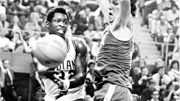 Indiana's Steve Downing passes the ball around UCLA's Bill Walton during the 1973 Final Four semifinal between the Hoosiers and Bruins. UCLA won 70-59.