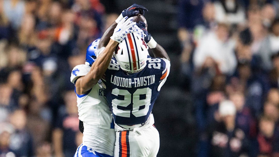 Auburn Tigers safety Kensley Louidor-Faustin (28) breaks up a pass intended for Kentucky Wildcats wide receiver DJ Miller (7) as Auburn Tigers take on Kentucky Wildcats at Jordan-Hare Stadium in Auburn, Ala. on Saturday, Nov. 1, 2025. Kentucky Wildcats defeated Auburn Tigers 10-3.