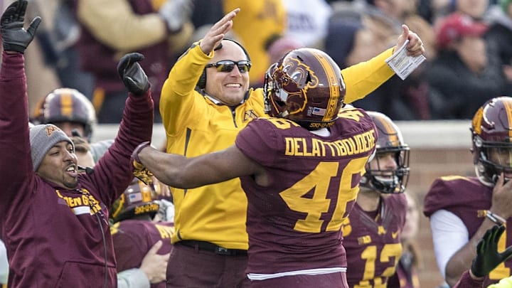 Nov 25, 2017; Minneapolis, MN, USA; Minnesota Golden Gophers head coach P.J. Fleck celebrates with Minnesota Golden Gophers defensive lineman Winston DeLattiboudere (46) after a fumble in the first half against the Wisconsin Badgers at TCF Bank Stadium. Mandatory Credit: Jesse Johnson-Imagn Images