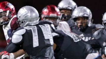 Harrisburg offensive lineman Kevin Brown (74) keeps his block during the 2022 PIAA Class 6A title game against St. Joseph's Prep.