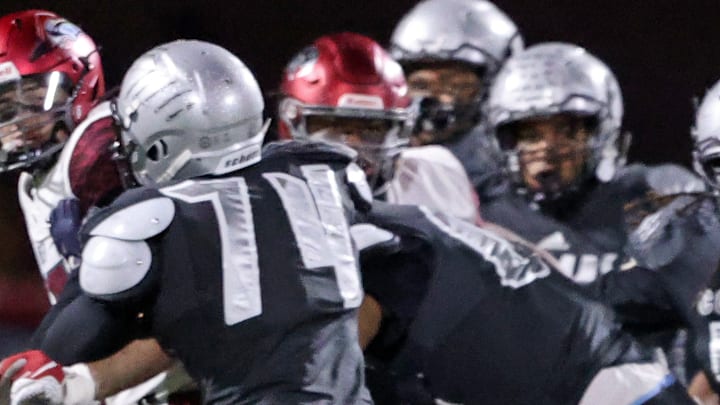 Harrisburg offensive lineman Kevin Brown (74) keeps his block during the 2022 PIAA Class 6A title game against St. Joseph's Prep. Harrisburg offensive lineman Kevin Brown (74) keeps his block during the 2022 PIAA Class 6A title game against St. Joseph's Prep.