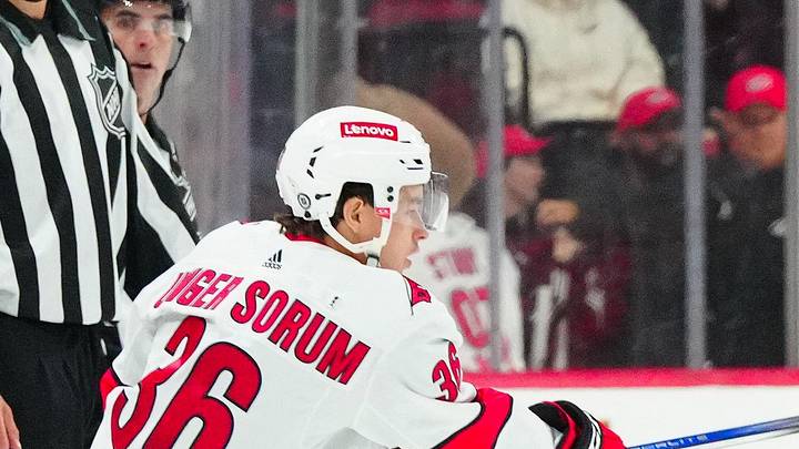 Sep 26, 2023; Raleigh, North Carolina, USA;  Carolina Hurricanes right wing Felix Unger Sorum (36) passes the puck against the Tampa Bay Lightning during the third period at PNC Arena. Mandatory Credit: James Guillory-Imagn Images