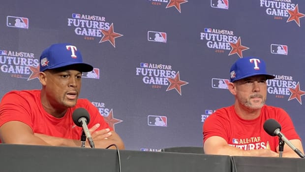 Former Texas Rangers teammates Adrian Beltre, left, and Michael Young managed the teams in the MLB Futures Game on Saturday. 