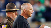 Notre Dame head coach Marcus Freeman, right, and NC State head coach Dave Doeren shake hands after Notre Dame won a NCAA football game 36-7 against NC State at Notre Dame Stadium on Saturday, Oct. 11, 2025, in South Bend.