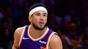 Dec 1, 2025; Los Angeles, California, USA;  Phoenix Suns guard Devin Booker (1) controls the ball against the against the Los Angeles Lakers during the first half at Crypto.com Arena. Mandatory Credit: Gary A. Vasquez-Imagn Images