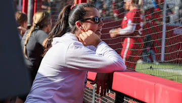 Arkansas coach Courtney Deifel looks on from the dugout against St. Louis in the first game of the Fayetteville Regional