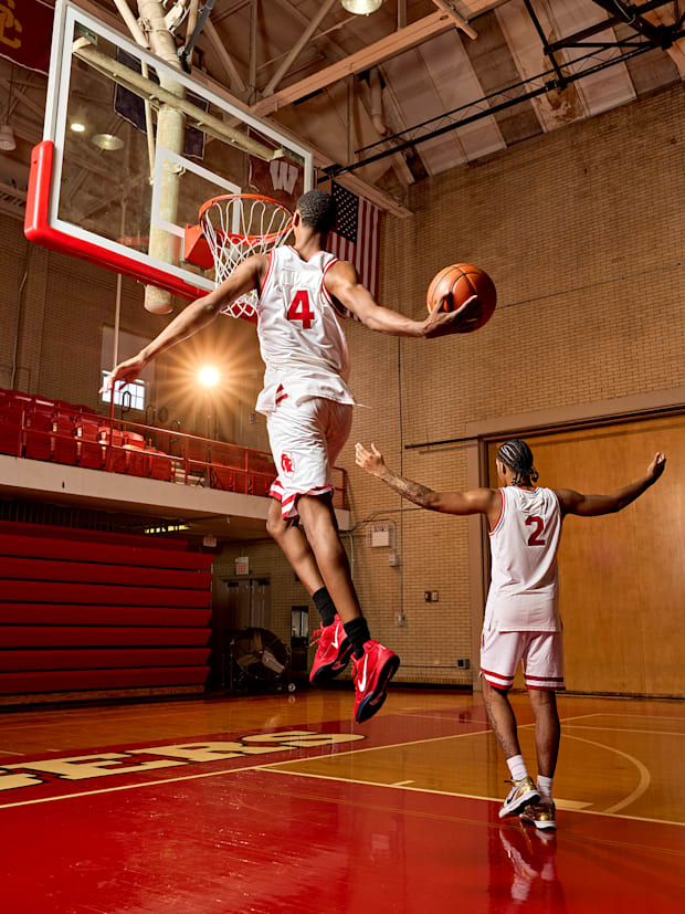 Ace Bailey goes for a dunk while Dylan Harper extends his arms in celebration. 