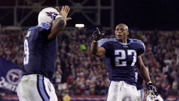 After scoring a second touchdown, Tennessee Titans quarterback Steve McNair, left, celebrates with running back Eddie George during their 24-7 victory over New England Patriots during the Monday Night game in Nashville Dec. 16, 2002.