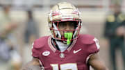 Aug 30, 2025; Tallahassee, Florida, USA; Florida State Seminoles running back Jaylin Lucas (12) runs with the ball against the Alabama Crimson Tide during the first half at Doak S. Campbell Stadium. Mandatory Credit: Melina Myers-Imagn Images