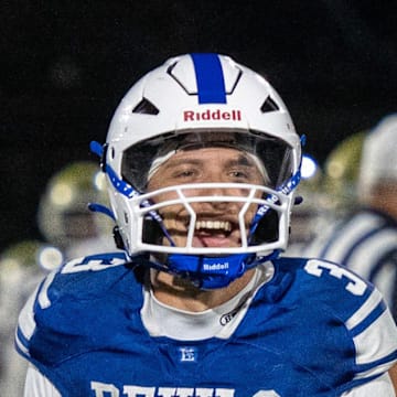 Leominster quarterback Osiris Lopez celebrates a win over against Doherty at Doyle Field Friday.