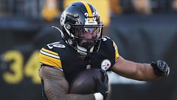 Dec 8, 2024; Pittsburgh, Pennsylvania, USA;  Pittsburgh Steelers running back Jaylen Warren (30) rushes the ball against the Cleveland Browns during the second quarter at Acrisure Stadium. Mandatory Credit: Charles LeClaire-Imagn Images