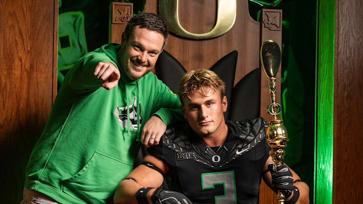 Oregon head coach Dan Lanning and McKay Madsen