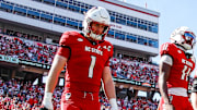 Oct 4, 2025; Raleigh, North Carolina, USA; NC State Wolfpack quarterback CJ Bailey (11), linebacker Caden Fordham (1), wide receiver Keenan Jackson (8) and offensive lineman Jr. Anthony Carter (75) walk out for the coin toss prior to the first half of the game against Campbell Fighting Camels at Carter-Finley Stadium. Mandatory Credit: Jaylynn Nash-Imagn Images