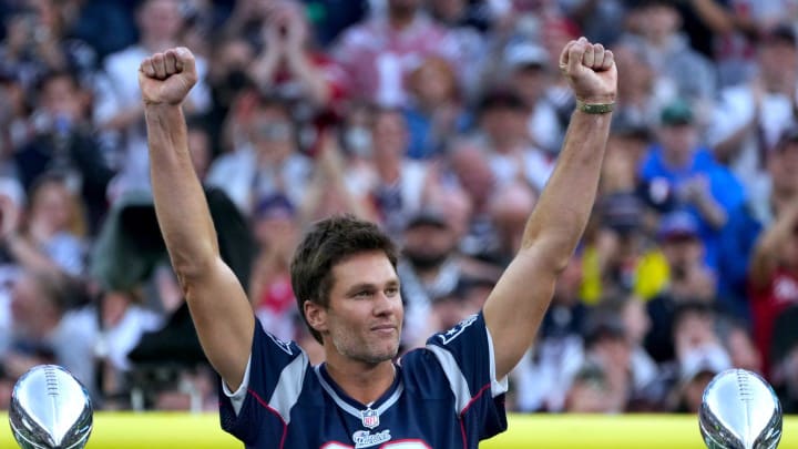 Tom Brady acknowledges his fans during a halftime celebration and the announcement of his induction in the the Patriots Hall of Fame.