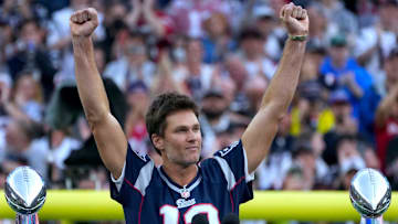 Tom Brady acknowledges his fans during a halftime celebration and the announcement of his induction in the the Patriots Hall of Fame.
