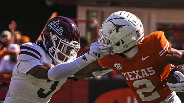 Texas Longhorns receiver Matthew Golden (2) is grabbed by the facemask by Mississippi State Bulldogs safety Brylan Lanier.