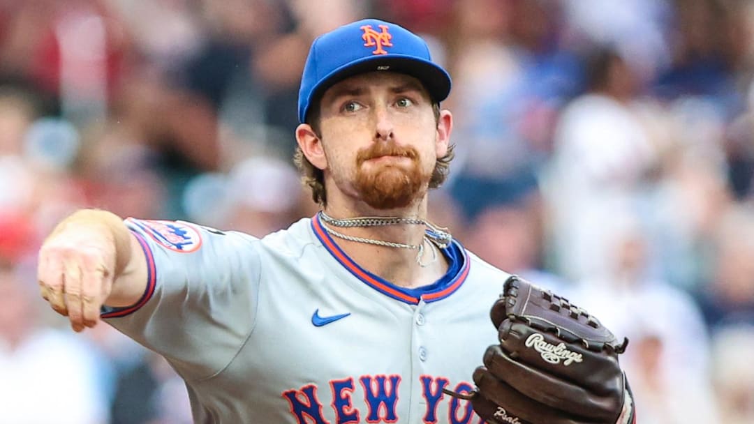 New York Mets pitcher Nolan McLean (26) throws to first base against the Atlanta Braves at Truist Park. 