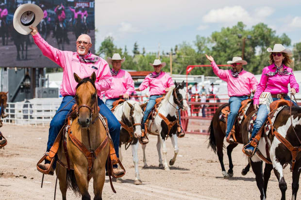 Committee chairs ride in the pre-rodeo parade at Cheyenne Frontier Days.