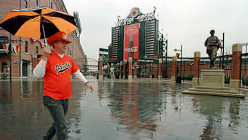 Baltimore Orioles fan Ron Kropkowski walks in the