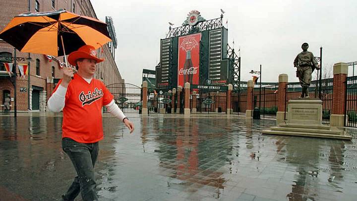Baltimore Orioles fan Ron Kropkowski walks in the