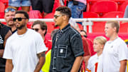 Kansas City Chiefs quarterback Patrick Mahomes watches warmups with teammates before the Nebraska-Cincinnati Game at Arrowhead Stadium.