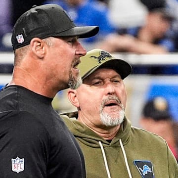 Detroit Lions head coach Dan Campbell talks to offensive coordinator John Morton.