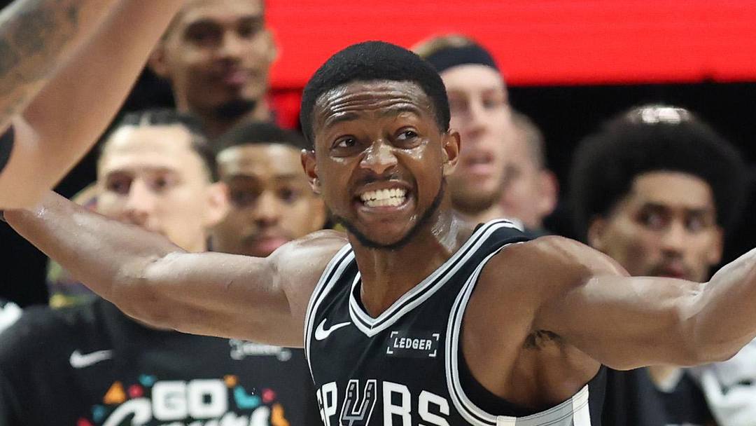 Apr 24, 2026; Portland, Oregon, USA; San Antonio Spurs guard De'aaron Fox (4) reacts after being called for a foul against the Portland Trail Blazers during the first half during game three of the first round of the 2026 NBA Playoffs at Moda Center. Mandatory Credit: Jaime Valdez-Imagn Images