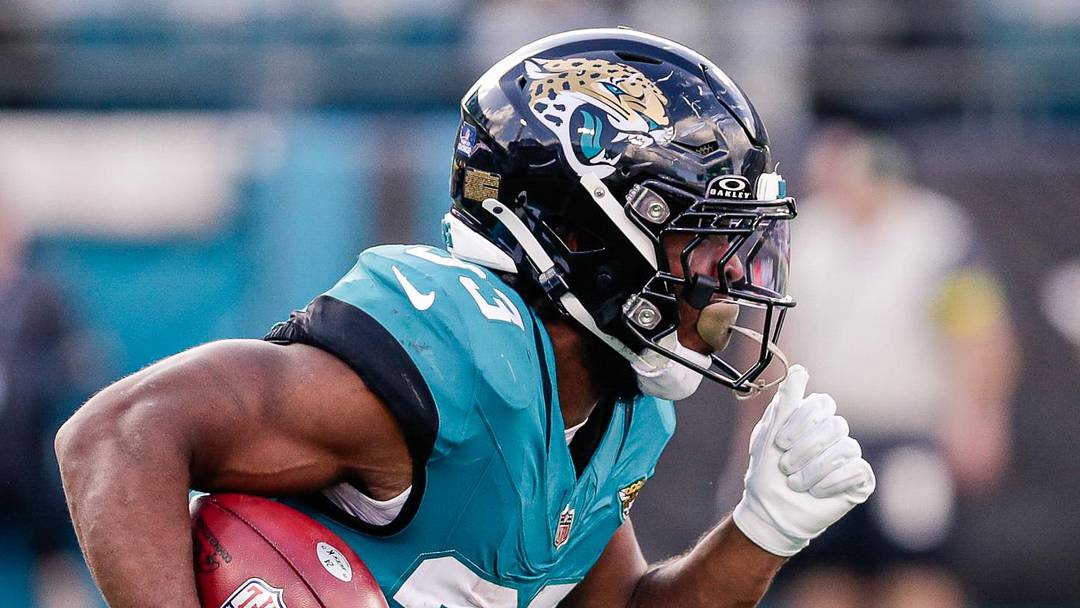 Dec 14, 2025; Jacksonville, Florida, USA; Jacksonville Jaguars running back Bhayshul Tuten (33) returns a kickoff against the New York Jets at EverBank Stadium. 