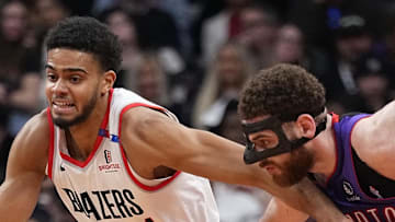 Portland Trail Blazers guard Rayan Rupert fights to get past Toronto Raptors forward Jamison Battle.