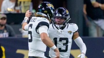Oct 19, 2023; New Orleans, Louisiana, USA; Jacksonville Jaguars quarterback Trevor Lawrence (16) celebrates a  touchdown with wide receiver Christian Kirk (13) against the New Orleans Saints during the fourth quarter at the Caesars Superdome. Mandatory Credit: Matthew Hinton-USA TODAY Sports