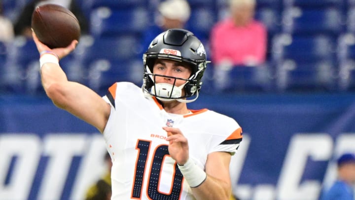 Denver Broncos quarterback Bo Nix (10) throws a warm up ball before the game against the Indianapolis Colts at Lucas Oil Stadium. 