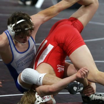 Bondurant-Farrar's Nolan Fellers tries to flip Hortonville's Henry Niebauer Friday, Dec. 1, 2023 at the Dan Gable Donnybrook Wrestling Tournament at Xtream Arena in Coralville, Iowa.