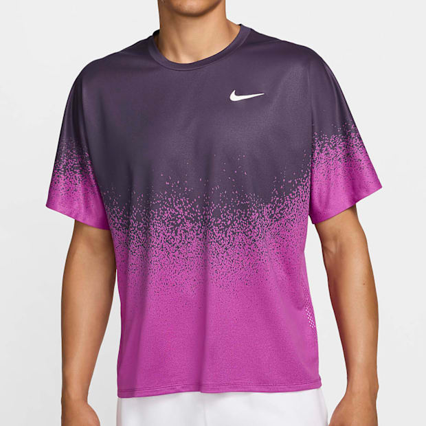 A purple and pink Nike tennis shirt.