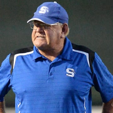 St. Mary's Springs head coach Bob Hyland stands on the field during halftime in a non-conference high school football season opener against Lake Country Lutheran on Friday, August 20, 2021, in Hartland, Wisconsin.