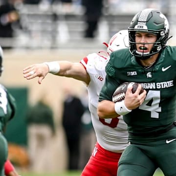 Michigan State's Sam Leavitt runs for a first down against Nebraska during the fourth quarter on Saturday, Nov. 4, 2023, at Spartan Stadium in East Lansing.