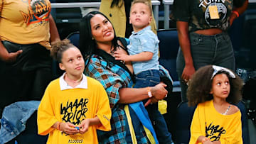 Ayesha Curry, wife of Golden State Warriors guard Stephen Curry (not pictured), with her children after winning game five of the 2022 western conference finals against the Dallas Mavericks.