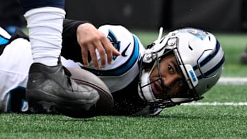 Dec 15, 2024; Charlotte, North Carolina, USA;  Carolina Panthers quarterback Bryce Young (9) fumbles the ball in the first quarter at Bank of America Stadium. Mandatory Credit: Bob Donnan-Imagn Images