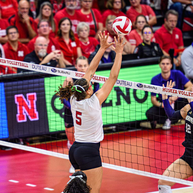 Rebekah Allick (5) goes up for a block. 