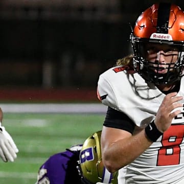 Lely's quarterback Carter Quinn (8) on a keeper. The Booker Tornadoes hosted the Lely Trojans (Naples, FL) Friday night, Aug. 23, 2024, who lost to Booker 46-0 during the first regular non-conference season game of the year.