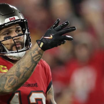 Jan 12, 2025; Tampa, Florida, USA; Tampa Bay Buccaneers wide receiver Mike Evans (13) reacts after a first down during the third quarter of a NFC wild card playoff against the Washington Commanders at Raymond James Stadium. Mandatory Credit: Nathan Ray Seebeck-Imagn Images