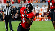 Sep 27, 2025; Raleigh, North Carolina, USA; North Carolina State Wolfpack running back Jayden Scott (4) runs towards the end zone  during the first half of the game against Virginia Tech Hokies at Carter-Finley Stadium. Mandatory Credit: Jaylynn Nash-Imagn Images