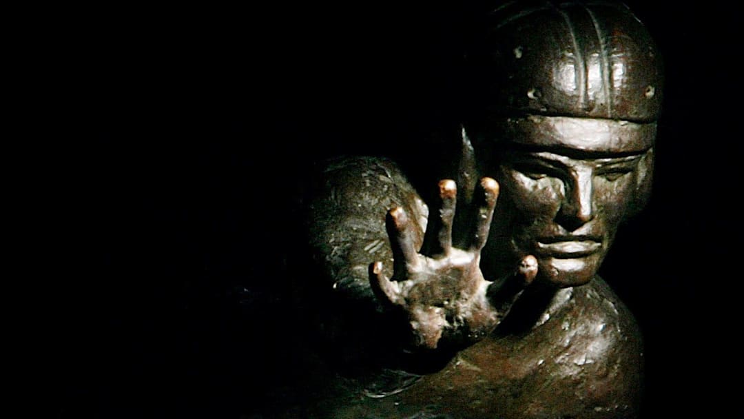 Ohio State's quarterback Troy Smith poses at the Woody Hayes Facility with a Heisman Trophy on Dec. 3, 2006.