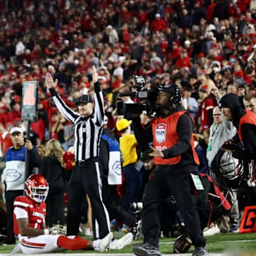Jacob De Jesus (21) celebrates his game-winning catch at Louisville