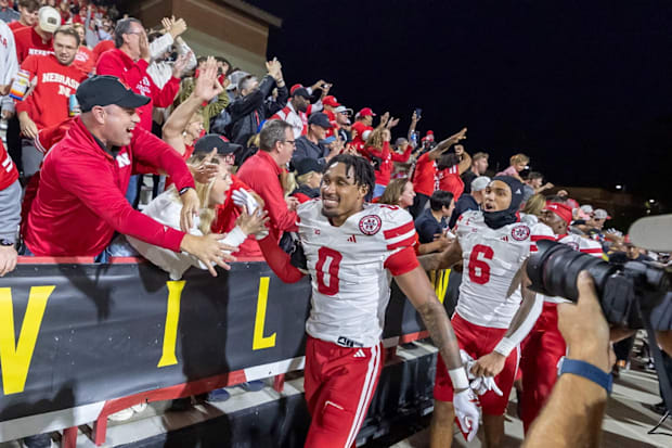 Linebacker Javin Wright and receiver Dane Key celebrate with fans after Nebraska's win at Maryland on Saturday, Oct. 11, 2025