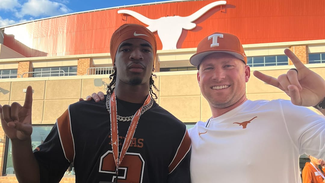 Zelus Hicks poses with coach Blake Gideon.
